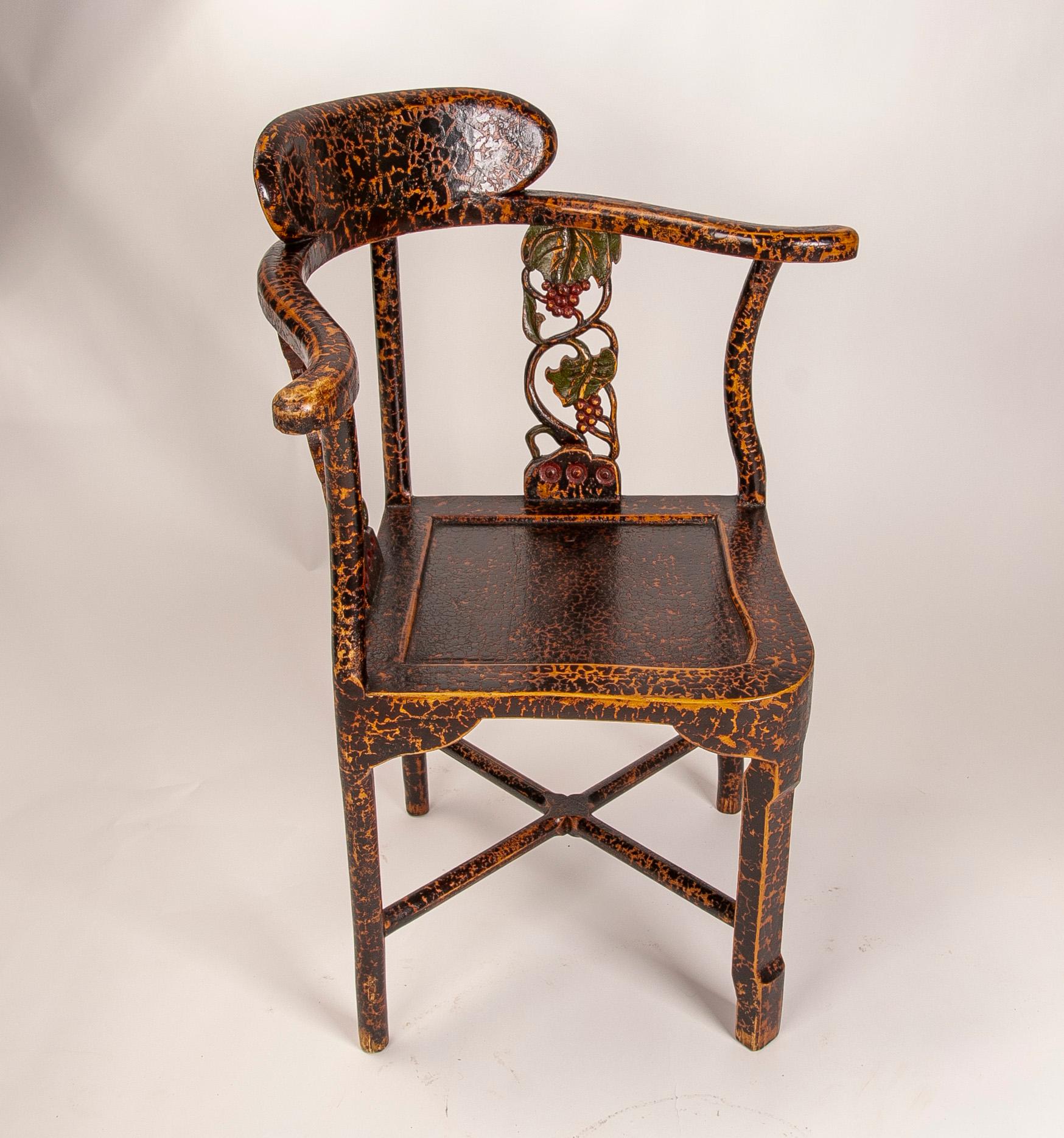 Asian Corner Chair with Lacquered Wooden Arms and Carved Flowers on the Backrest For Sale