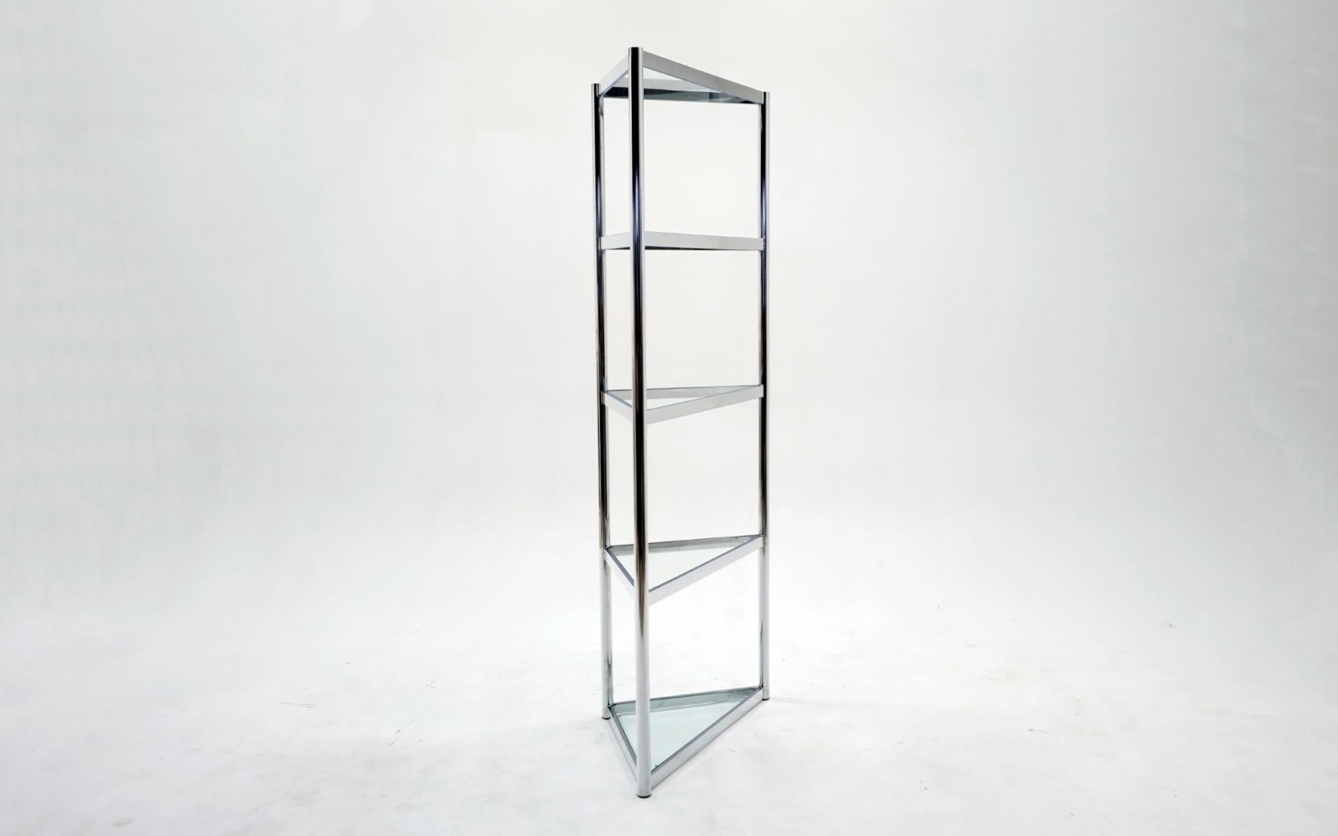 Tall glass and chrome triangular corner display / etagere in the style of Milo Baughman. Five Shelves including the top.