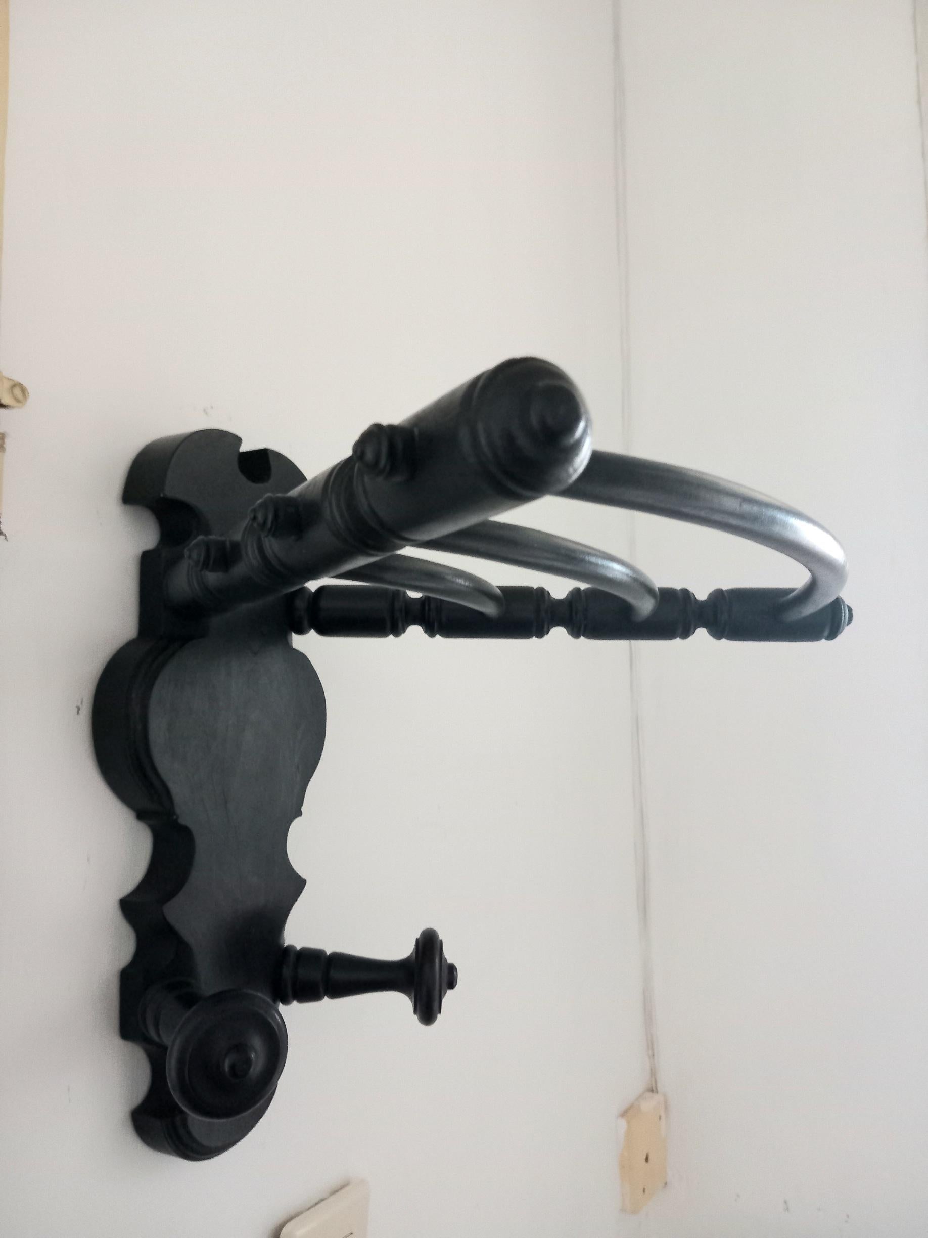 Spectacular, rare 19th century corner wall coat rack

It comes from a palatial house in Spain
 I never saw one like it

It is emmonized in black, very typical of many period furniture.
A beauty of coat rack. Can be placed in the corner or on