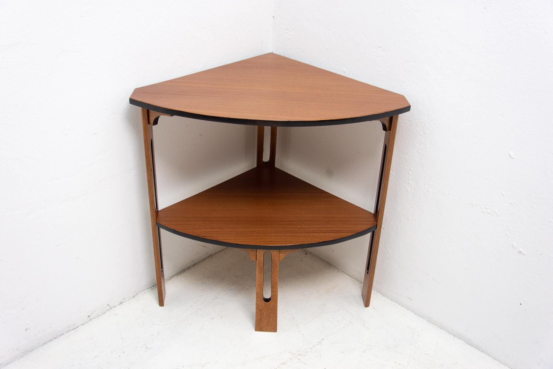 corner side table Art Deco, 1930’s, Czechoslovakia The table was made in the 1930s in the former Czechoslovakia in the ART DECO style. It is made of mahogany and beech wood. The edges and inner parts of the table are lined with black lacquered