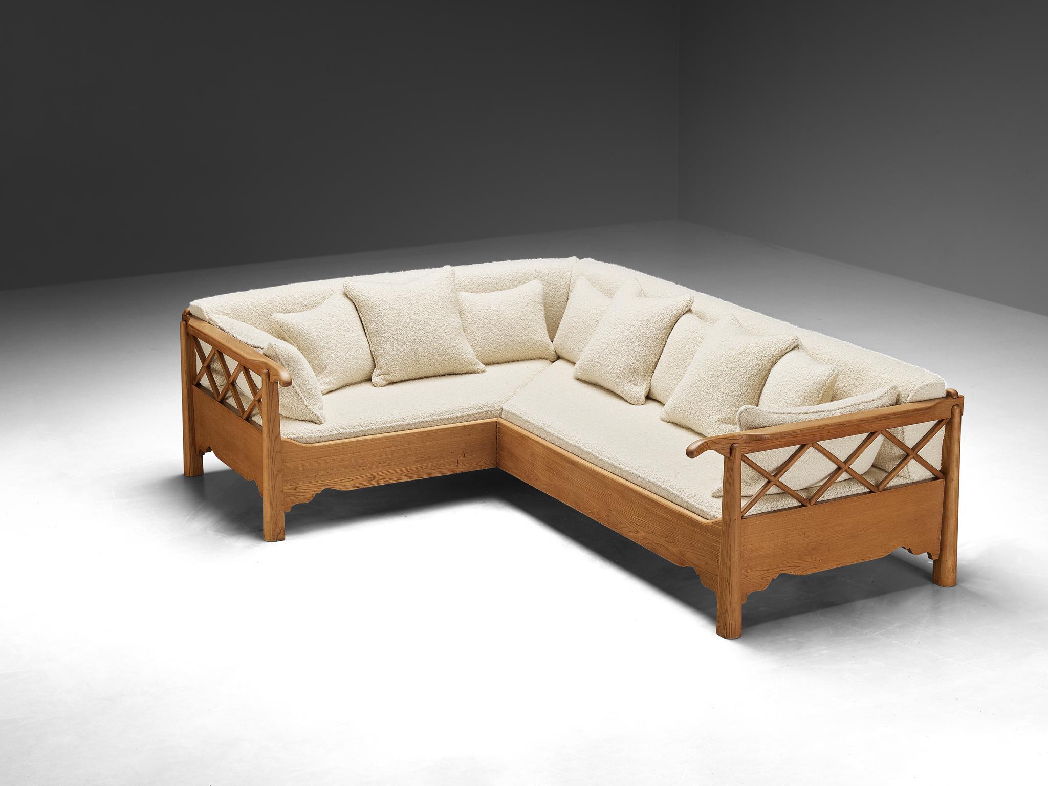 Corner sofa, elm, reupholstered in boucle fabric by Pierre Frey, Europe, 1960s

Corner sofa with classical elements, made in Europe in the 1960s. Crafted from elm wood, this sofa embodies both strength and grace. Its sturdy frame, a testament to the
