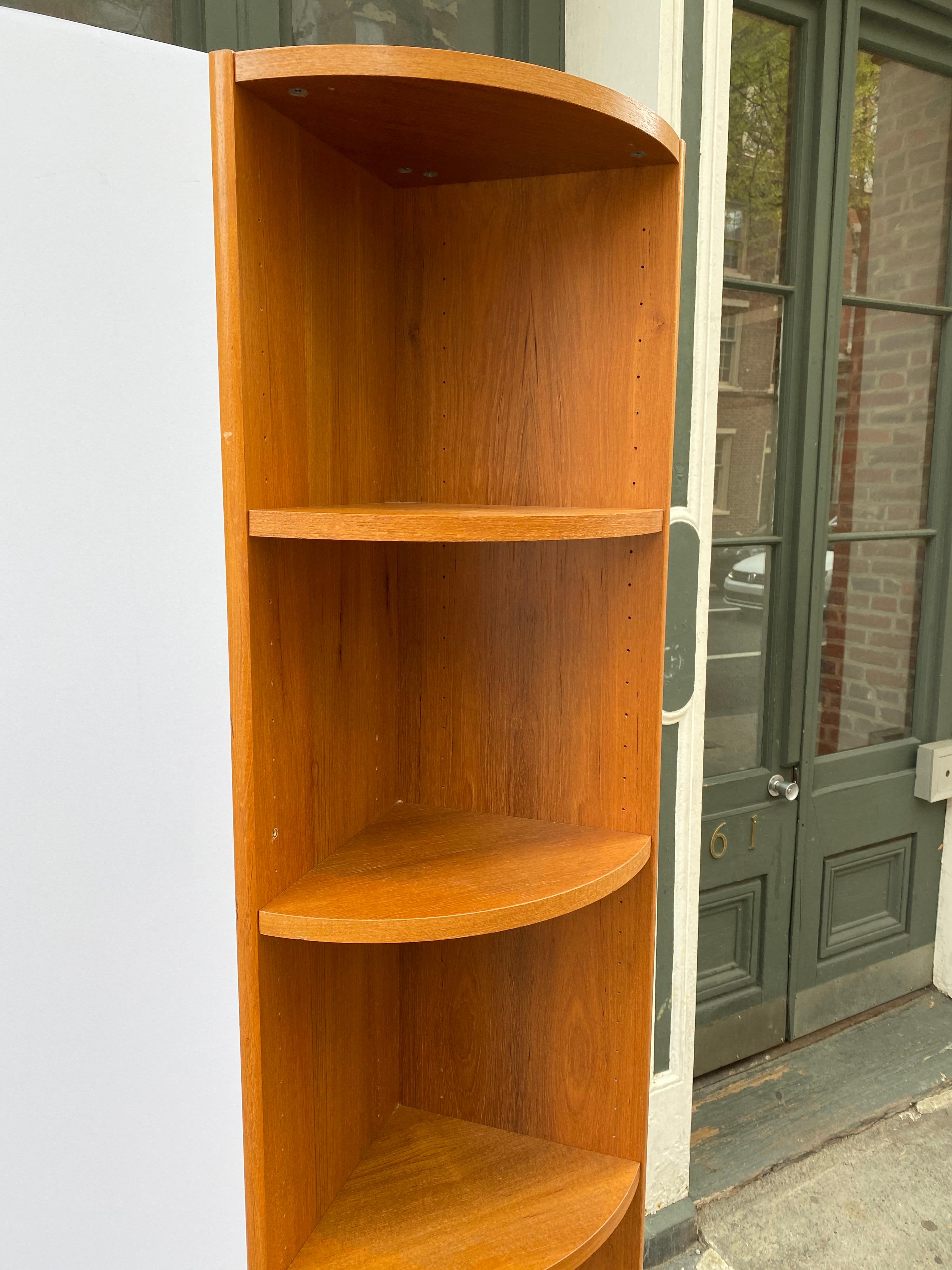 Teak corner shelf. Perfect size for that little corner! Nice teak wood with adjustable shelves. Standing at 83.25 tall and 12