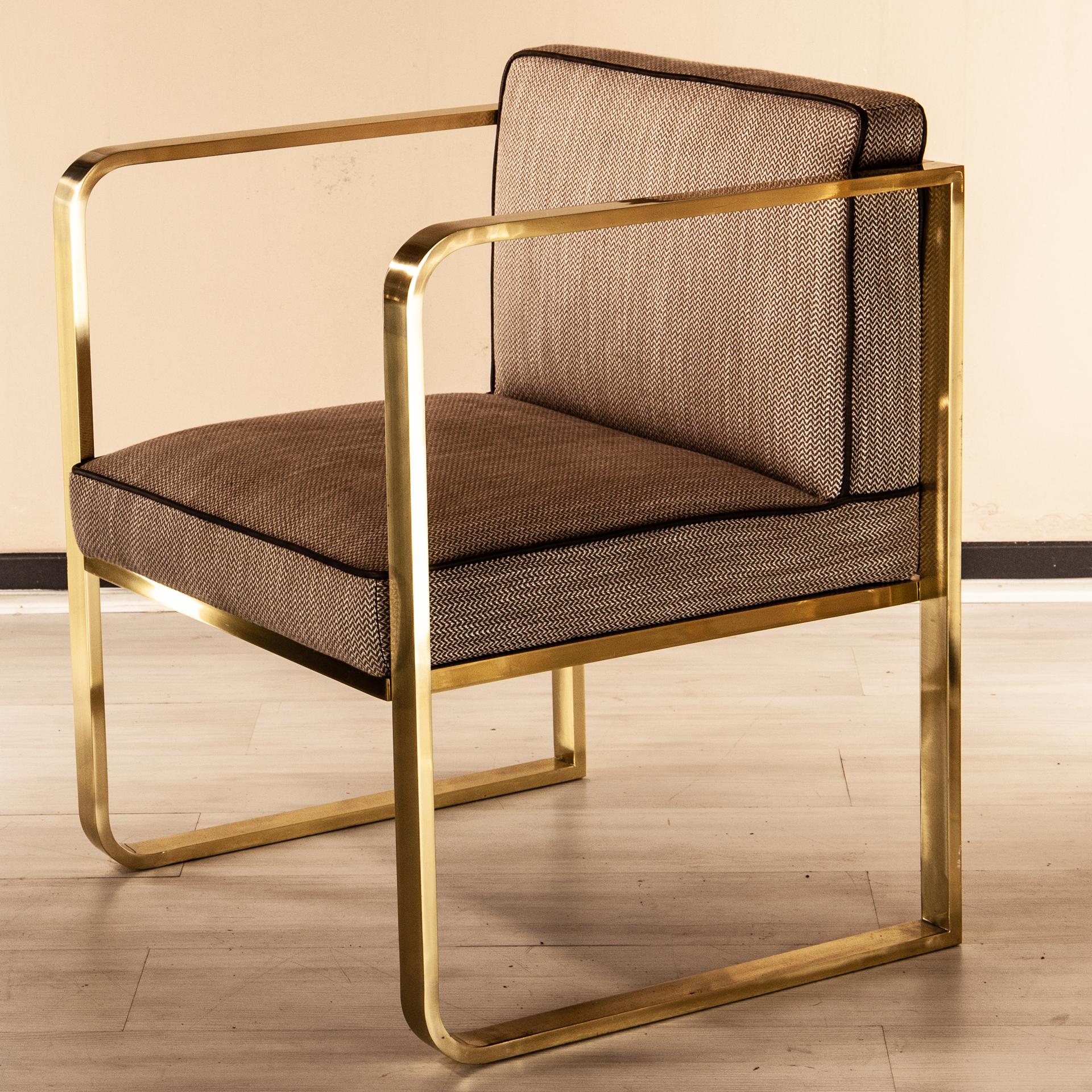 Modern design armchair made with a brass frame and upholstered in fabric.

An elegant timeless design by Selezioni Domus Firenze with a distinctive midcentury look.
Can be used as dining set with a marble-top table or an occasional chair to pick