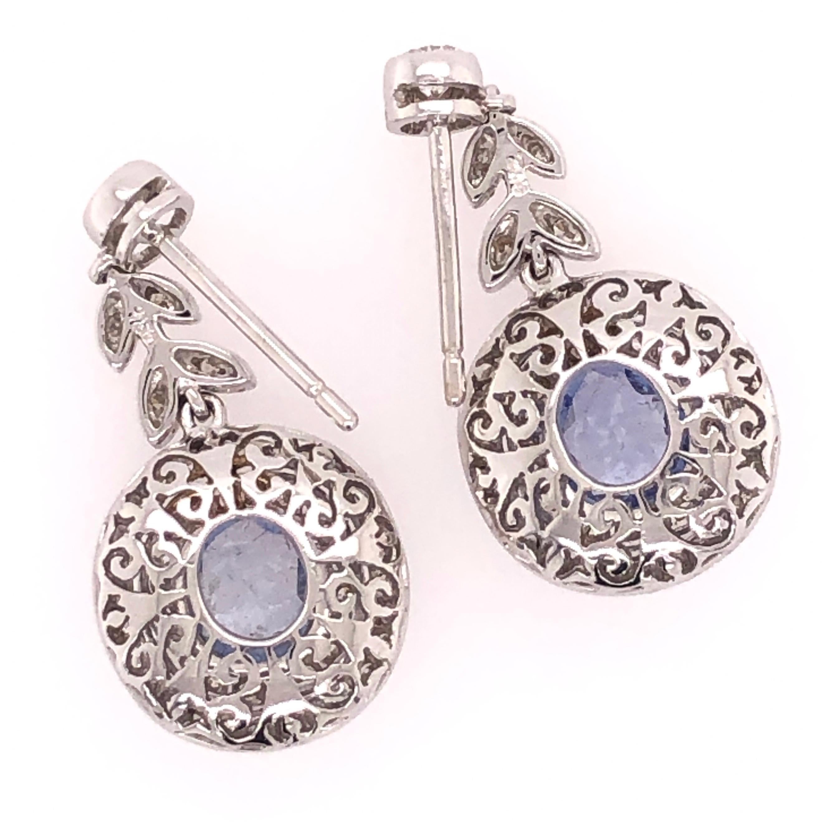 Simply Beautiful finely detailed Drop Earrings set with Cornflower Blue Sapphires, approx. total weight of the 2 Sapphires 2.08tcw surrounded by Diamonds, approx. 1.05tcw. Approx. 1.10