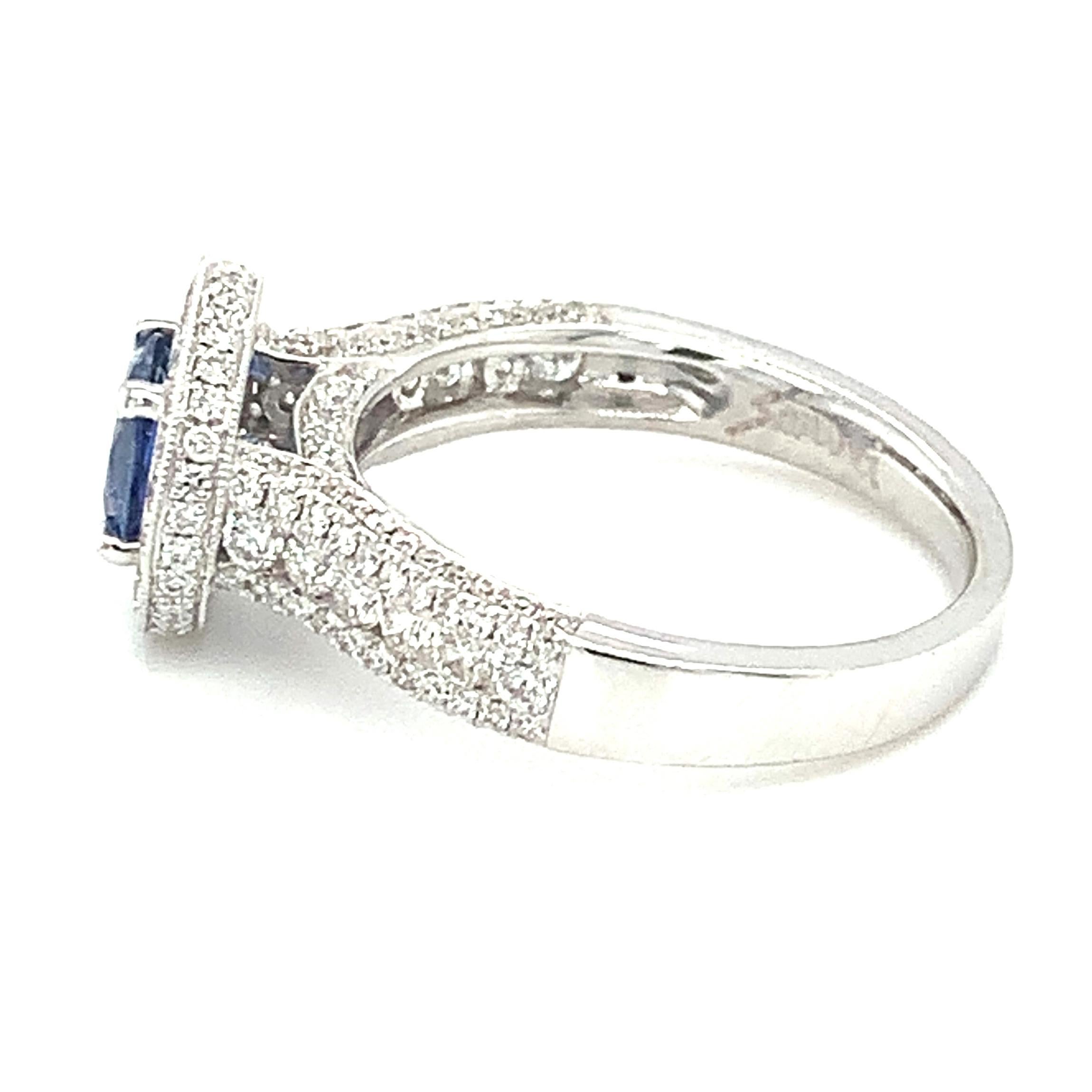 Round Cut Cornflower Blue Sapphire and Diamond Halo Engagement Ring in 18k White Gold For Sale