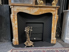 yellow marble fireplace frame complete with black cast iron backsplash, italy