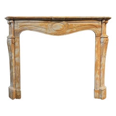 yellow marble fireplace frame complete with black cast iron backsplash, italy