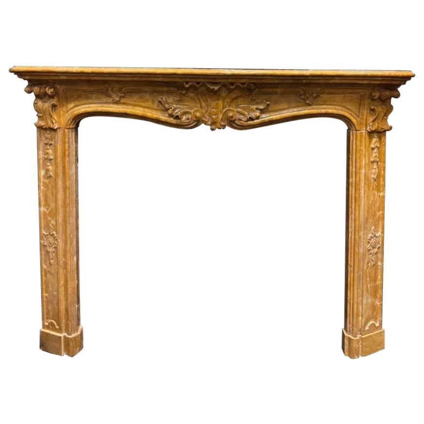 Siena yellow marble fireplace frame, carved, Italy
