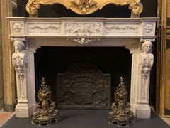Monumental fireplace frame made of richly carved white marble, Italy