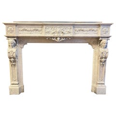 Monumental fireplace frame made of richly carved white marble, Italy