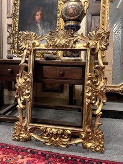 Gilt frame with finely carved floral motifs, italy