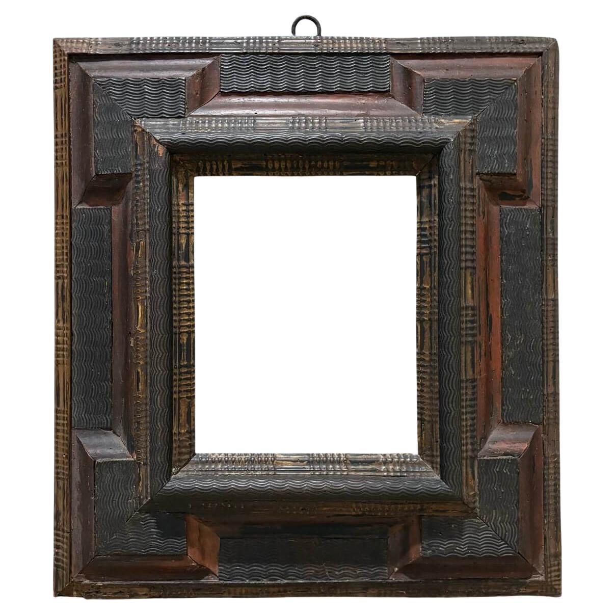 Cornice in Legno Intagliato a decoro Guilloche XVII secolo