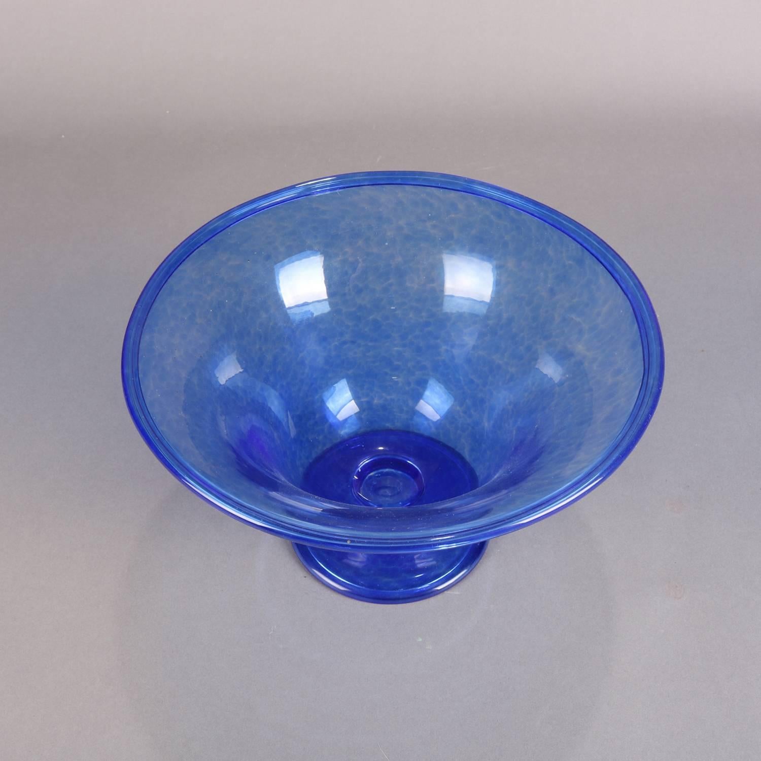 Cobalt blue blown glass footed bowl by Corning Museum of Glass features flared form and is signed on base CMOG, home of Steuben, 20th century

Measures: 5.5