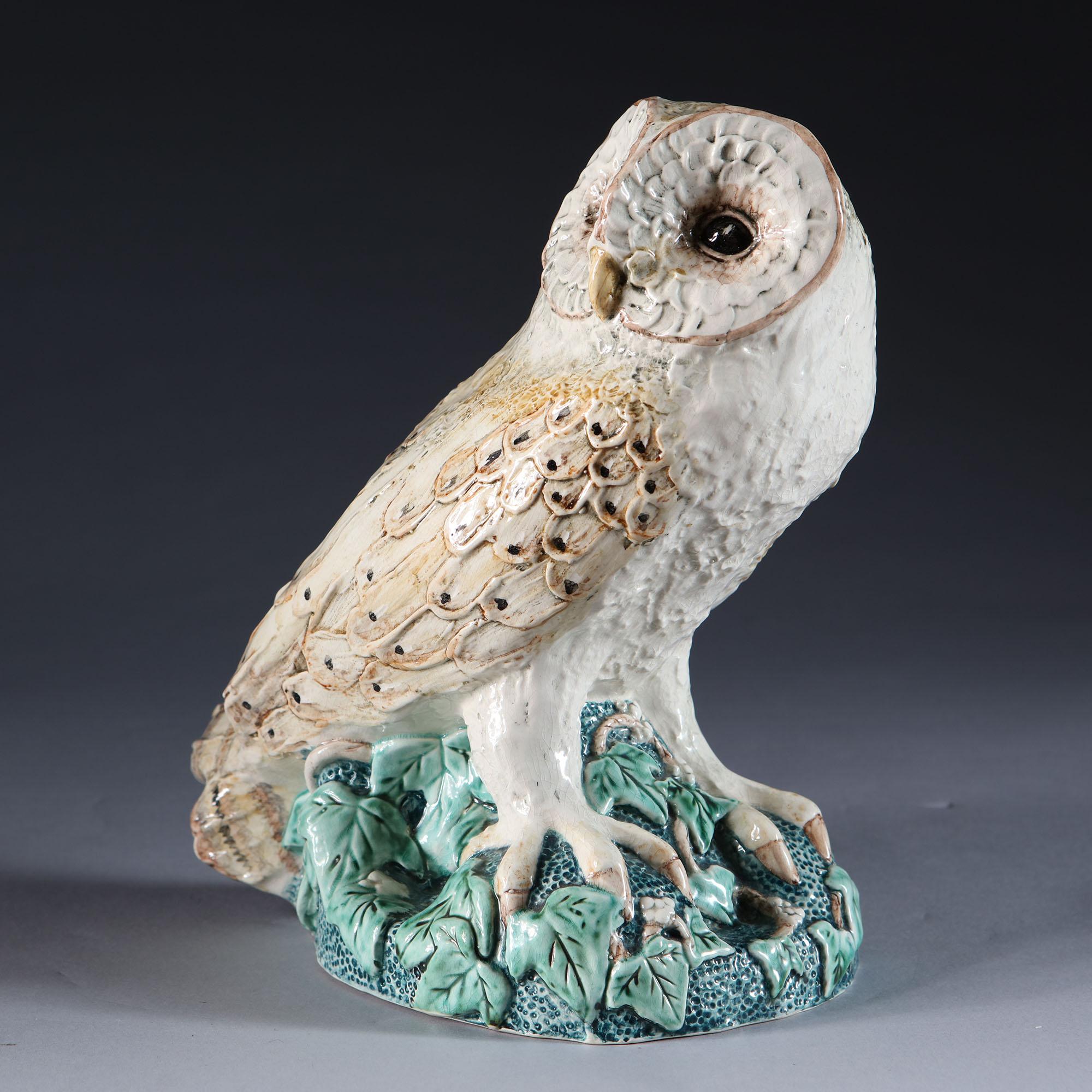 An unusual realistically modelled art pottery barn owl perching on a leafy outcrop. By Margaret Howard.

Margaret Howard was a potter based in St Ives, she produced one off pottery groups for Fortnum & Mason and for collectors and enthusiasts over