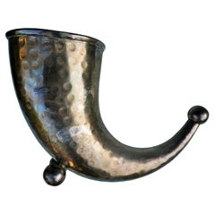 Cornucopia flower holder in silver. Punches