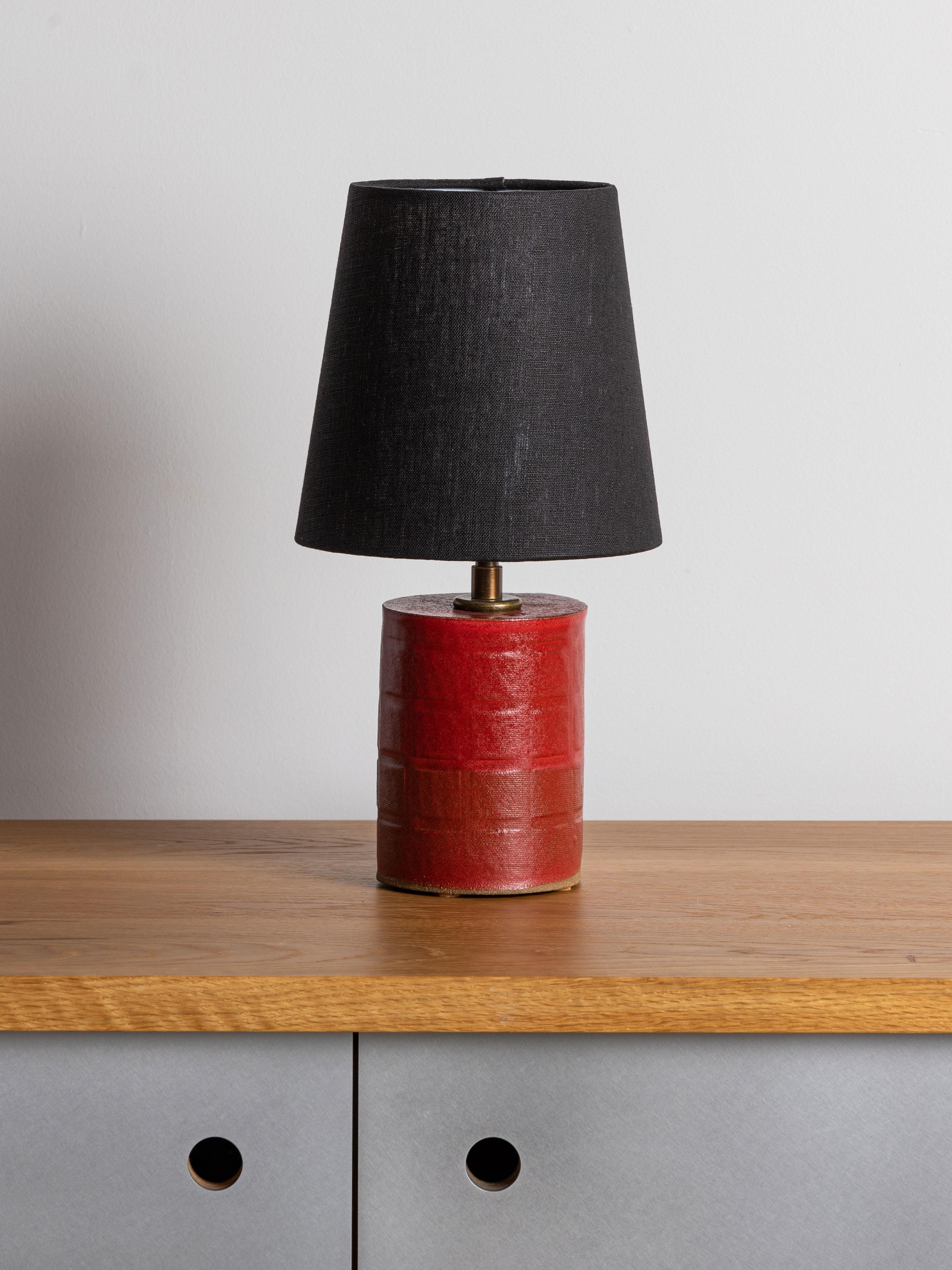 Our stoneware Cornwall Lamp is handcrafted using slab-construction techniques. The lamp’s pattern is created by rolling the surface with textured rolling pins and rods.

Finish

- Dipped glaze, pictured in cherry
- Antique brass fittings
- Twisted
