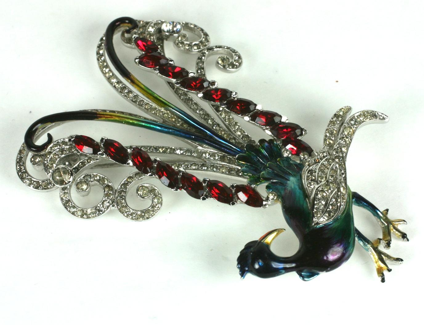 Rare Art Deco Coro Lyre Bird brooch of pastes and ombre technicolor enamels from the 1940's. The elegant bird is decorated with vibrant, original enamels along with the elaborate pave work and faux ruby marquises. 
Amazing design and condition from