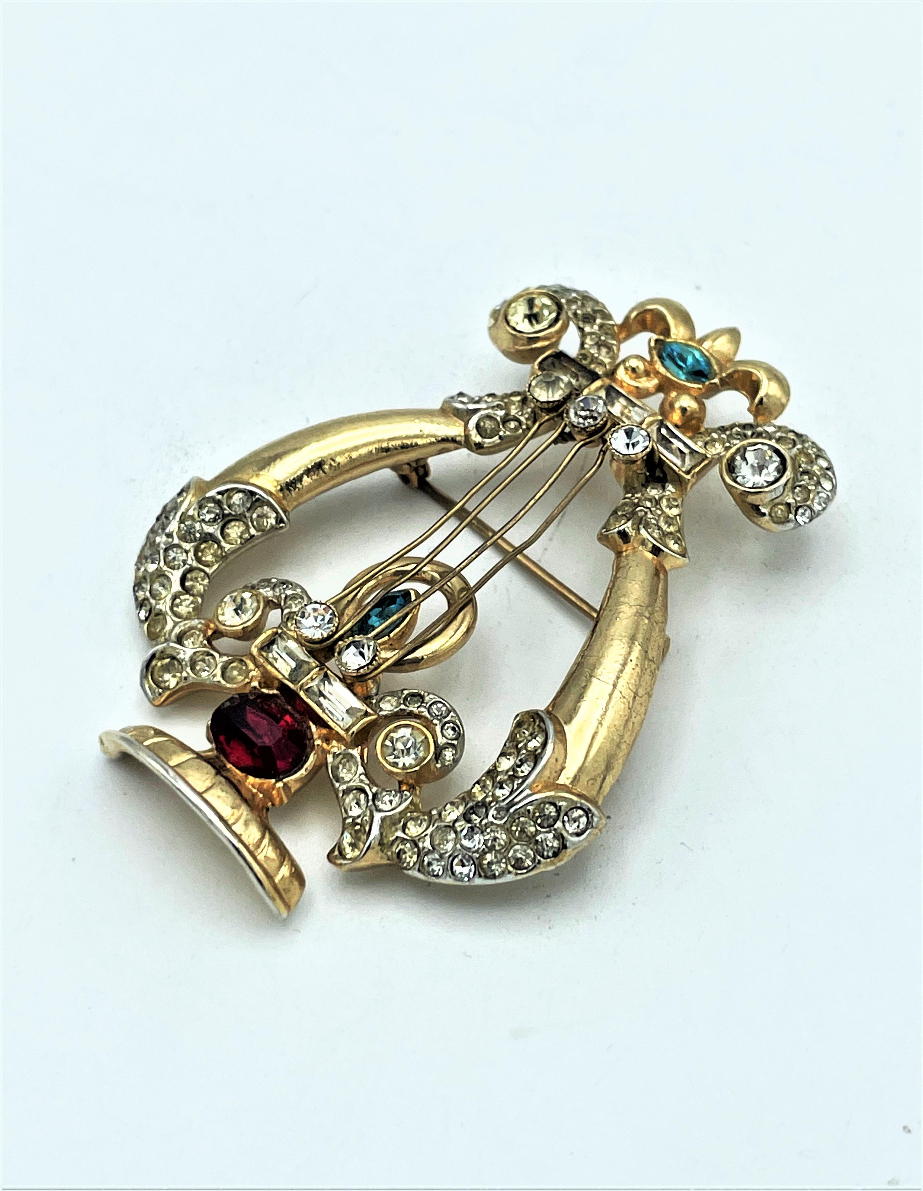 Coro brooch in the form of a string instrument, rhinestones, g. plated ...