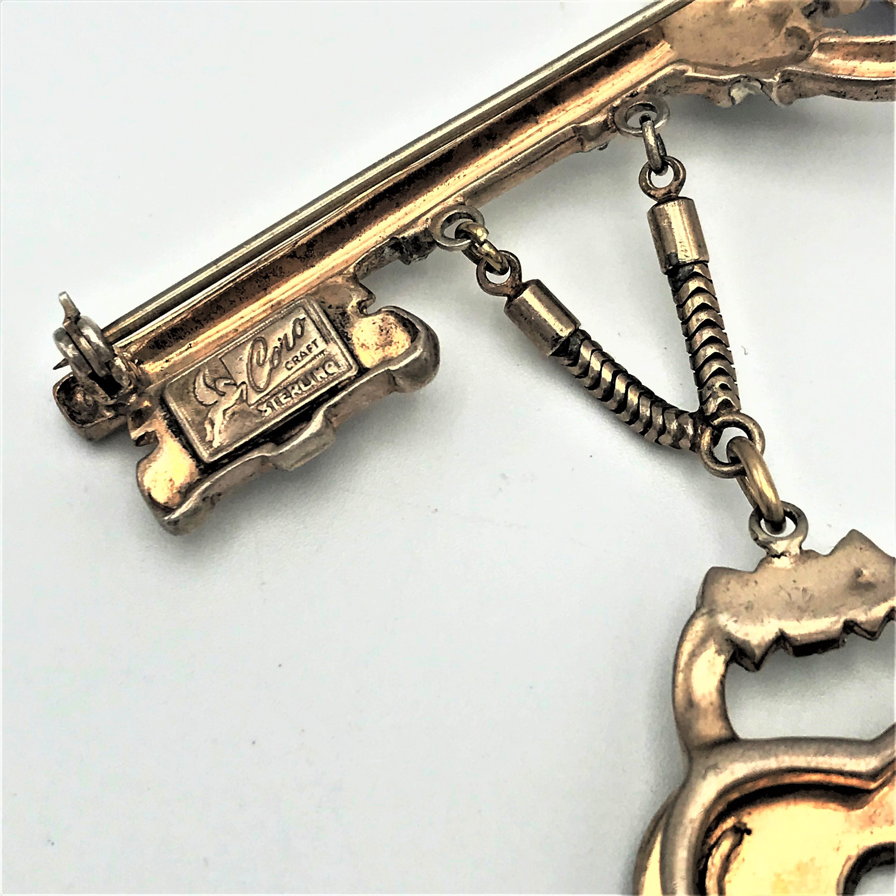 Artisan  Coro Craft brooch in the shape of a key with attached lock sterling gold plated For Sale