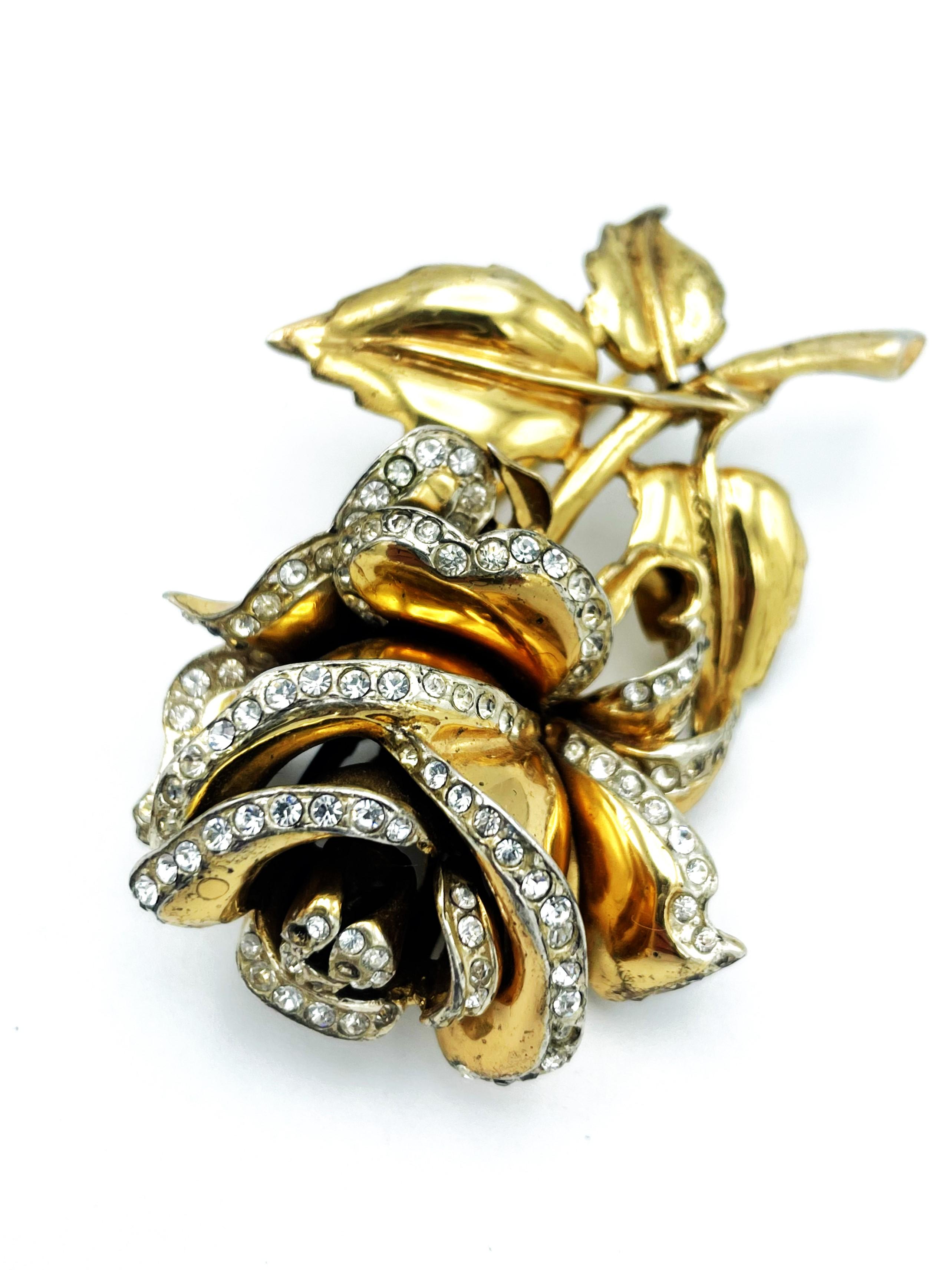 BLOSSOMING!
The brooch celebretes its comeback and lets your outfits shine!

A fully bloomed rose with small rhinestones on each petal. 
Measureme:  Hight 6 cm Wide 4, Deep 2 cm, 
Features
- Signed 'Coro Craft Sterling' 
- Sterling gold plated 
-