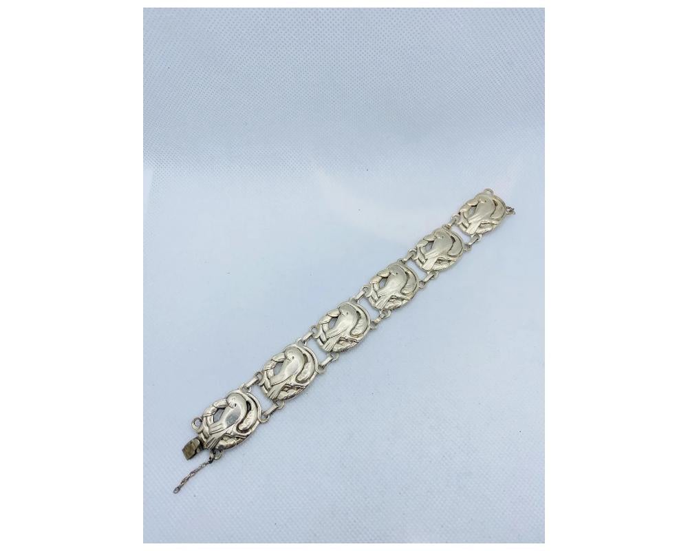 Coro Norseland Sterling Silver Vintage Bracelet With 6 Birds 
total weight approximately 40 Grams 
overall good condition please see photos for more details there is some tarnishing to the back side of some of the birds. 
some minor surface