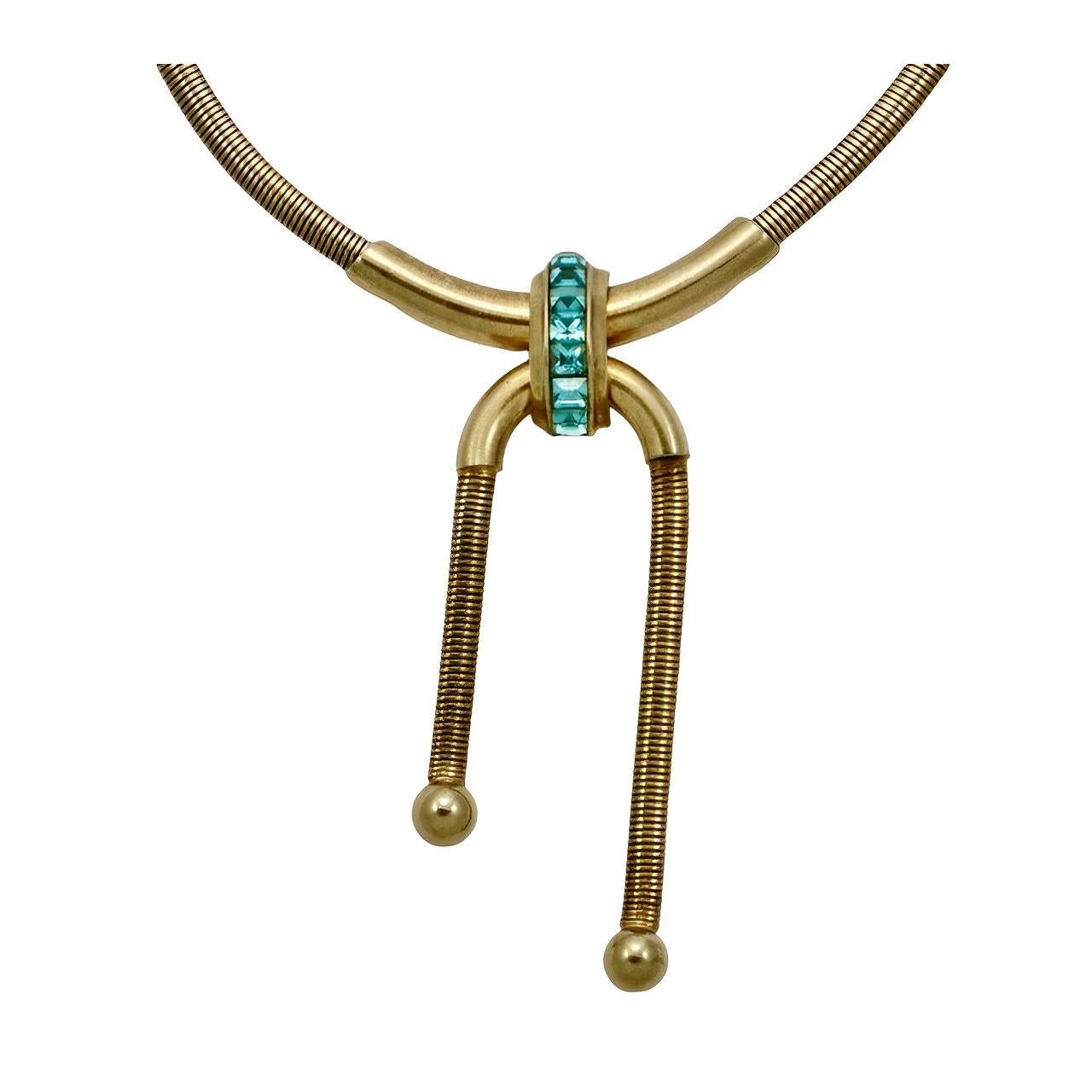 Coro Pegasus gold plated snake chain necklace featuring a beautiful aqua blue rhinestone pendant centrepiece. The pendant is free moving on the chain.

Measuring necklace length 42.5 cm / 16.7 inches, and the maximum length of the centrepiece is 8.7
