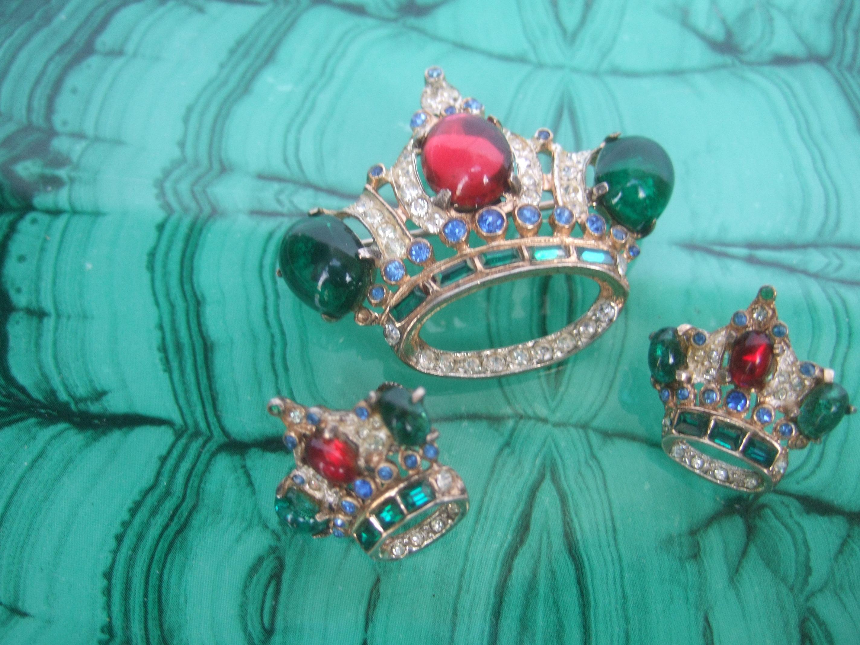 Coro Sterling gilt vermeil crown brooch & earrings set c 1950s
The elegant sterling crown brooch & scew back earrings are embellished jewel-tone glass cabochons combined with baguette crystals, clear & colored diamante crystals 

The crown brooch is