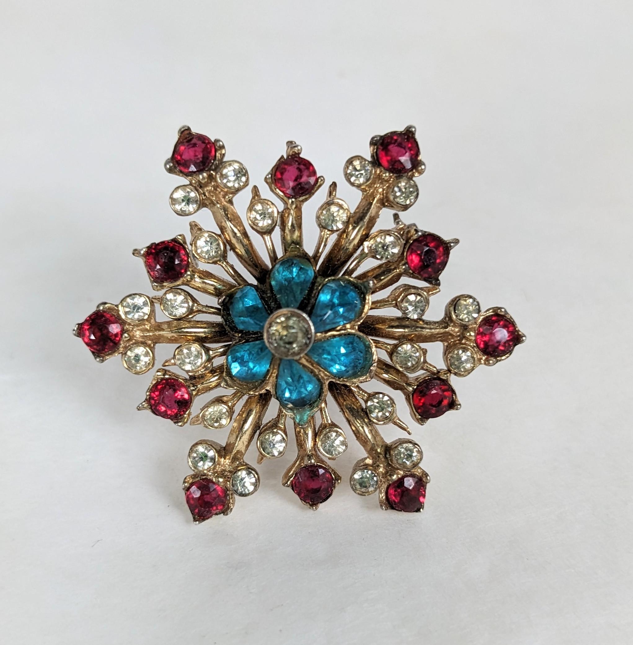 Charming Coro Sterling Retro Star Brooch from the 1940's. Sterling with rose gold vermeil set with aqua, crystal and ruby pastes. 1.5