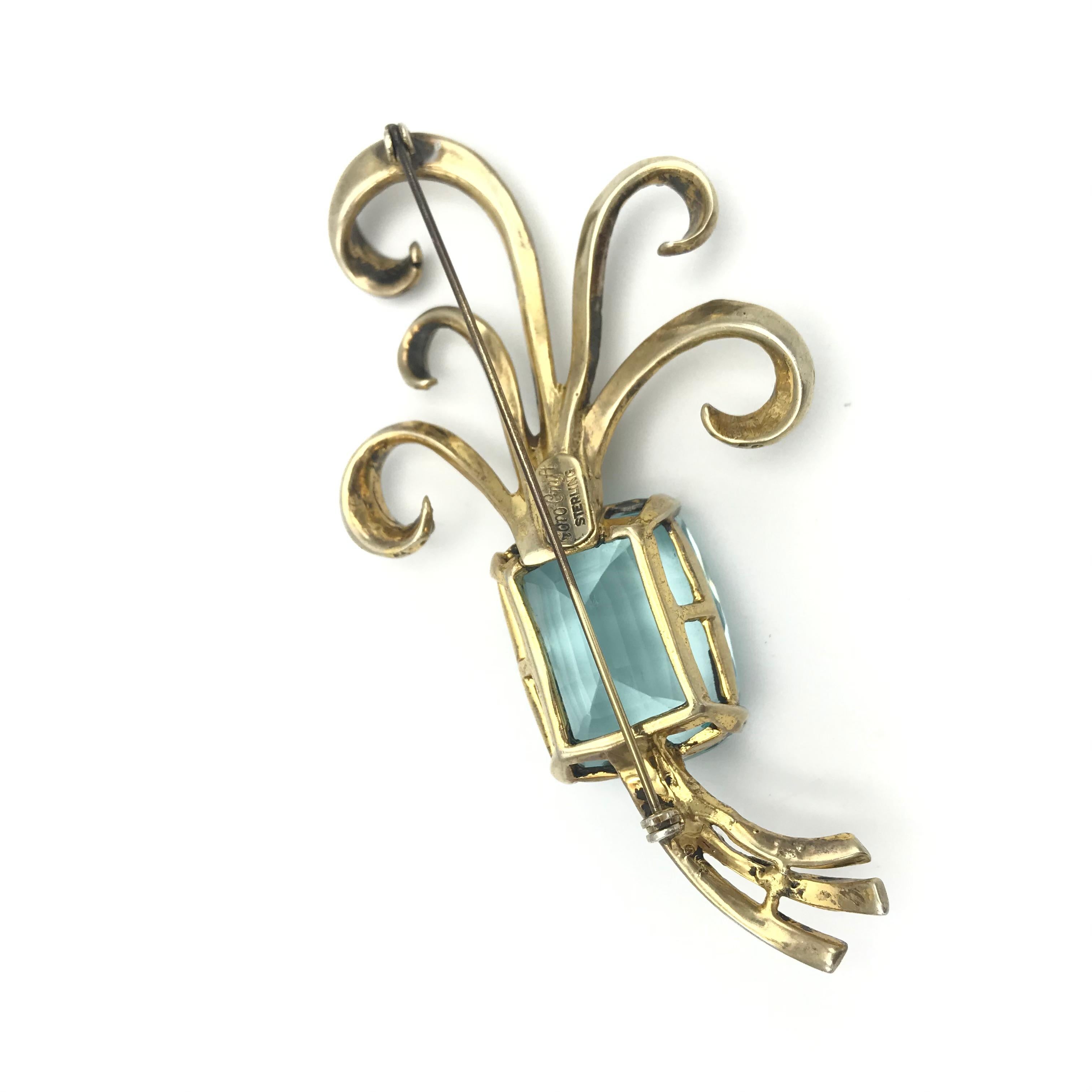 Women's Corocraft Sterling deco gold plated brooch with faux table cut aquamarin 1943's For Sale