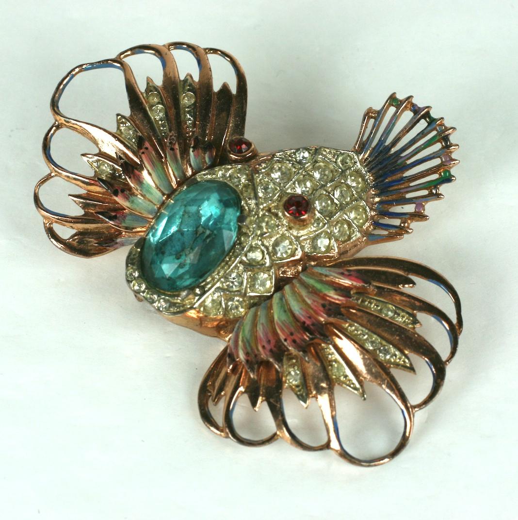 Striking Corocraft Sterling Enamel Clown Fish Brooch set in pink gold plated sterling with enamel accents. A large faux oval aquamarine is clutched in the mouth. 1940's USA. 
 3
