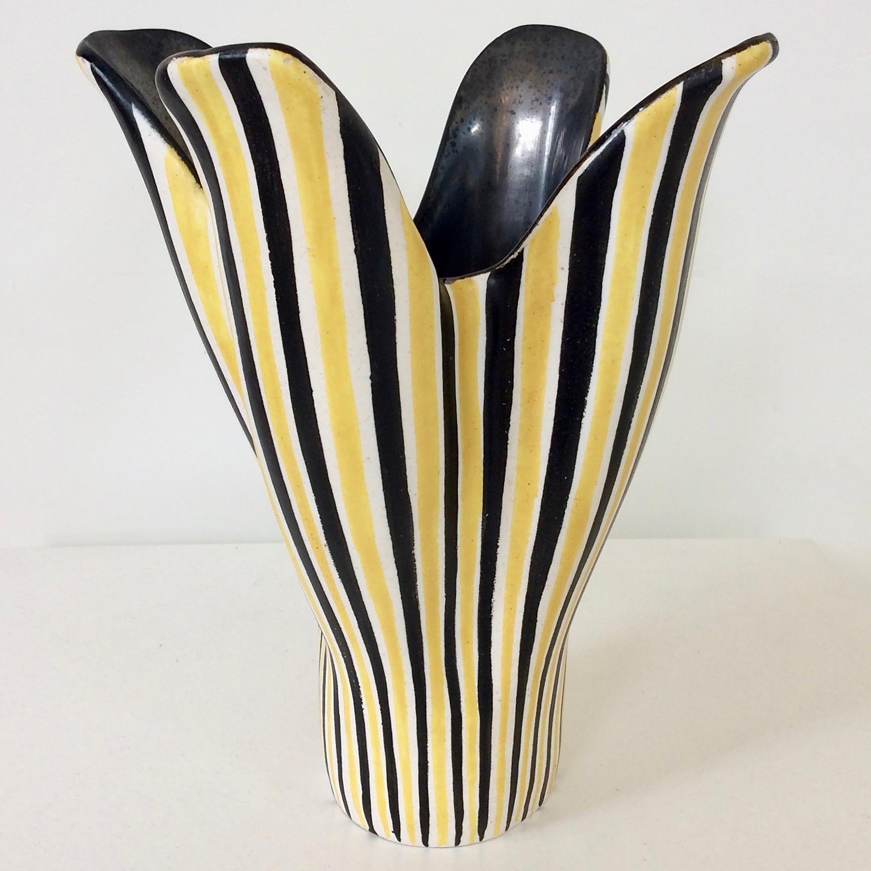 Elegant corolla vase, circa 1950, France.
Enameled ceramic stripped in white, black, yellow.
Black enamel inside.
Signed underneath.
Dimensions: 28 cm height, 24 cm diameter.
All purchases are covered by our Buyer Protection Guarantee.
This