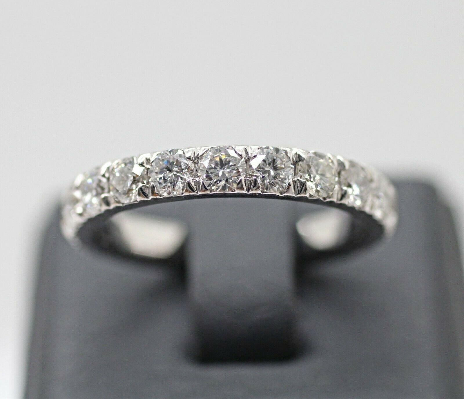  Corona 18k white gold diamond eternity ring 1.50cts. ring size is 6.25 containing,
Specifications:
    main stone: ROUND DIAMONDS
    diamonds: 17 PIECES
    carat total weight: APPROXIMATELY 1.50
    color: F
    clarity: SI2
    brand: CUSTOM
   