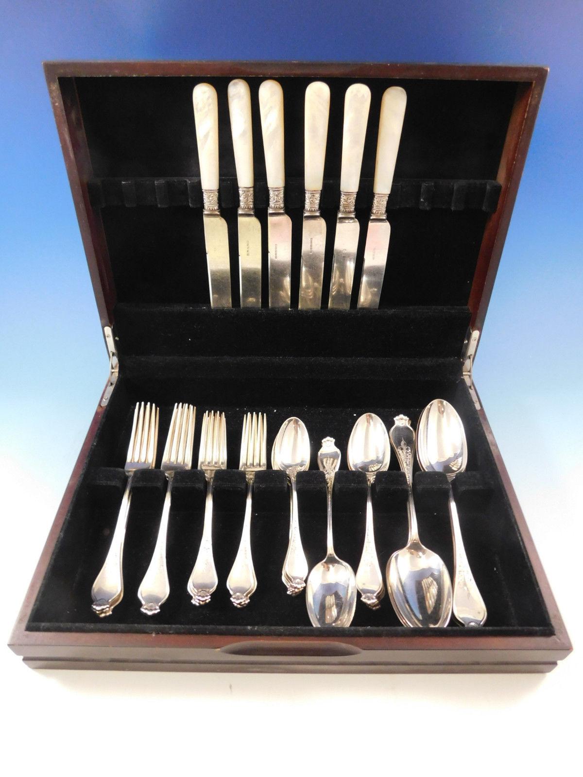 Rare Corona by Dominick & Haff, circa 1885 sterling silver flatware set with shell motif and engraved detailing, 36 pieces. This scarce early set includes:

6 dinner size knives, 9 3/4