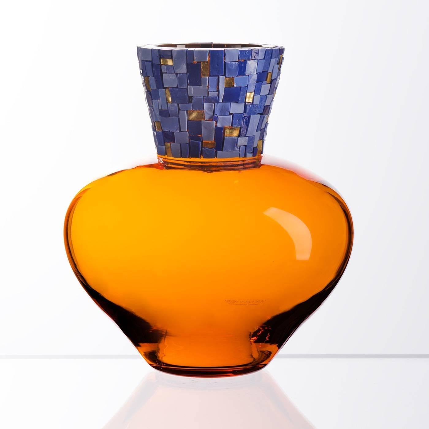 Murano master glass-blowers are renowned all-over the world for their craftsmanship that allows them to create stunning artistic pieces of great beauty and value. An elaborate mosaic in rich blue and gold colors graces the neck of this refined