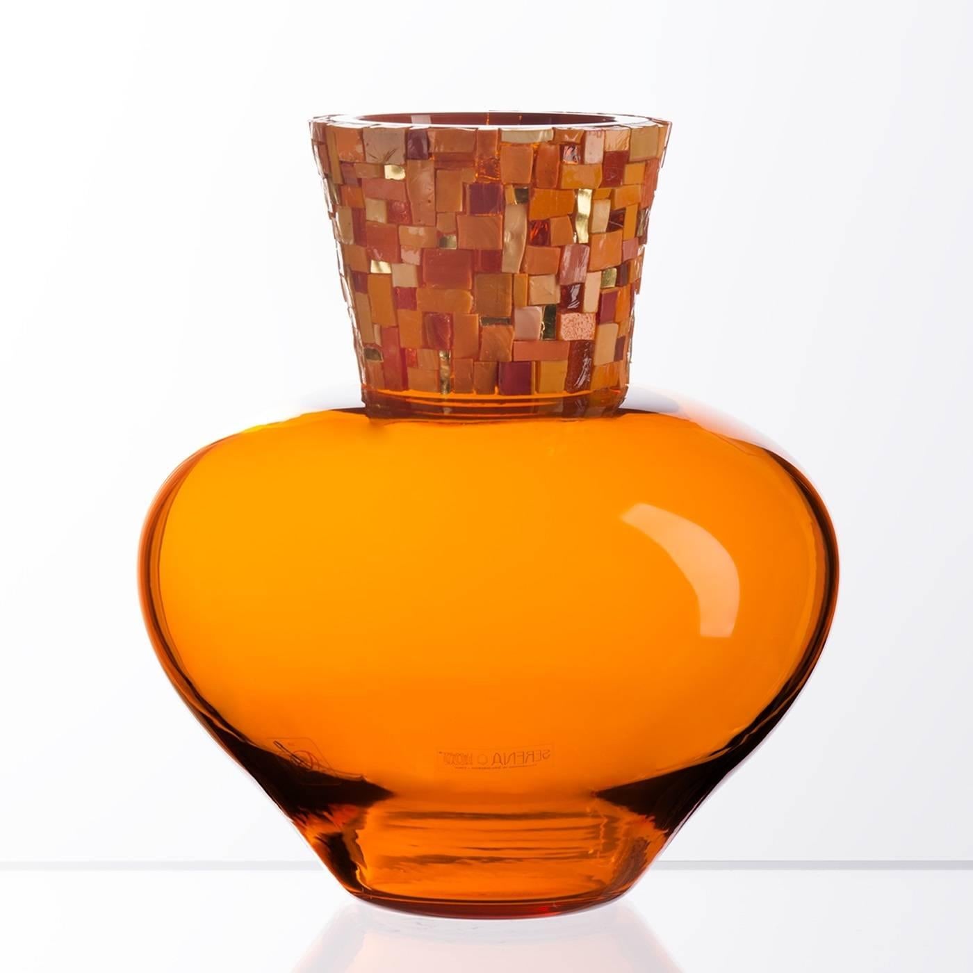 This vase showcases the craftsmanship of the Venetian master glass-blowers who use centuries-old techniques to infuse modern trends and styles into their creations. The bright mosaic detail combines precious tesserae made of gold foil with opaque