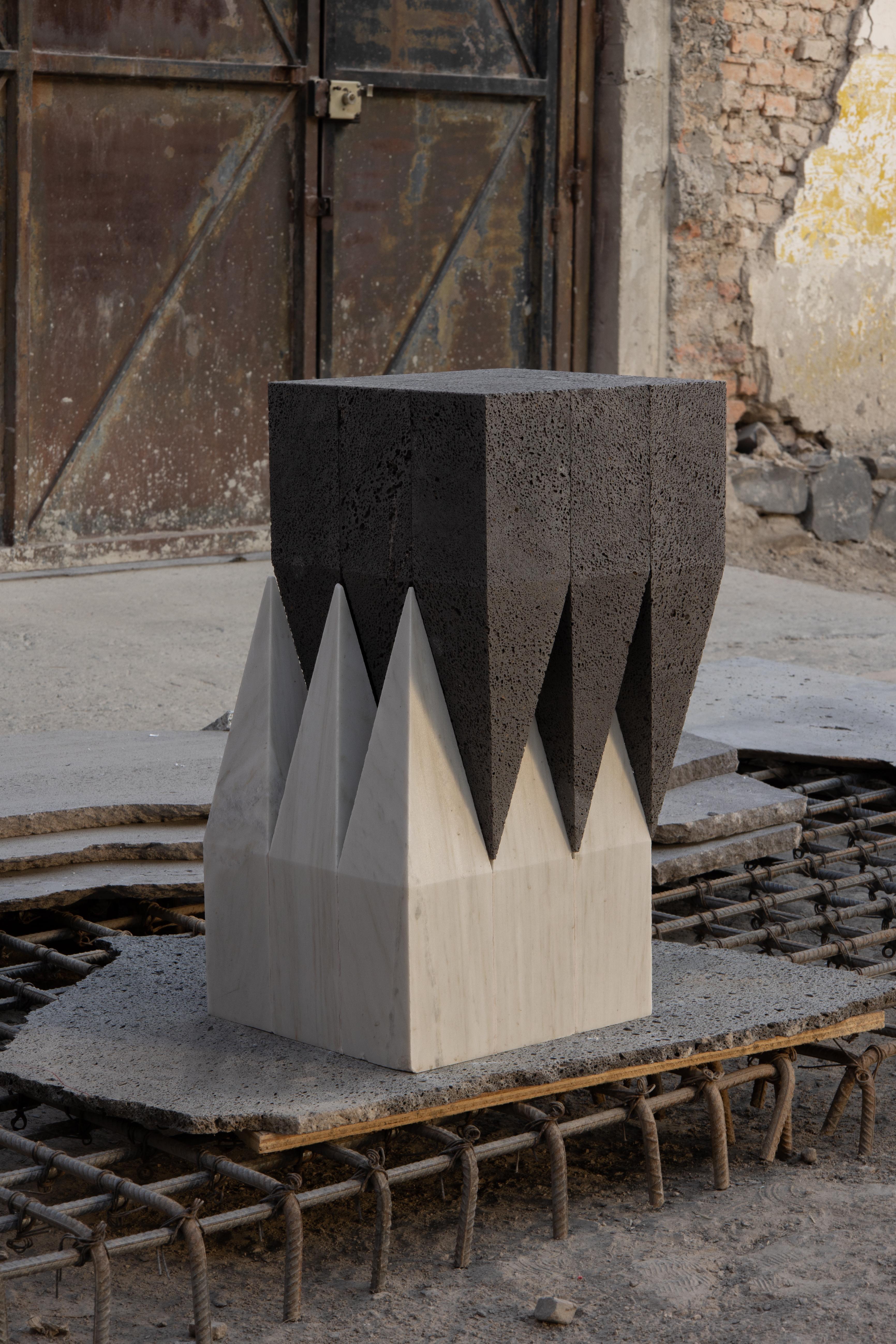 Corona Side Table in Carrara Marble & Volcanic Stone by Alina Rotzinger
Materials: Carrara marble and volcanic stone.
Dimensions: D 20 x W 20 x H 140 cm.

Composed by Alina Rotzinger as design director and artist, and Sebastian Rotzinger as