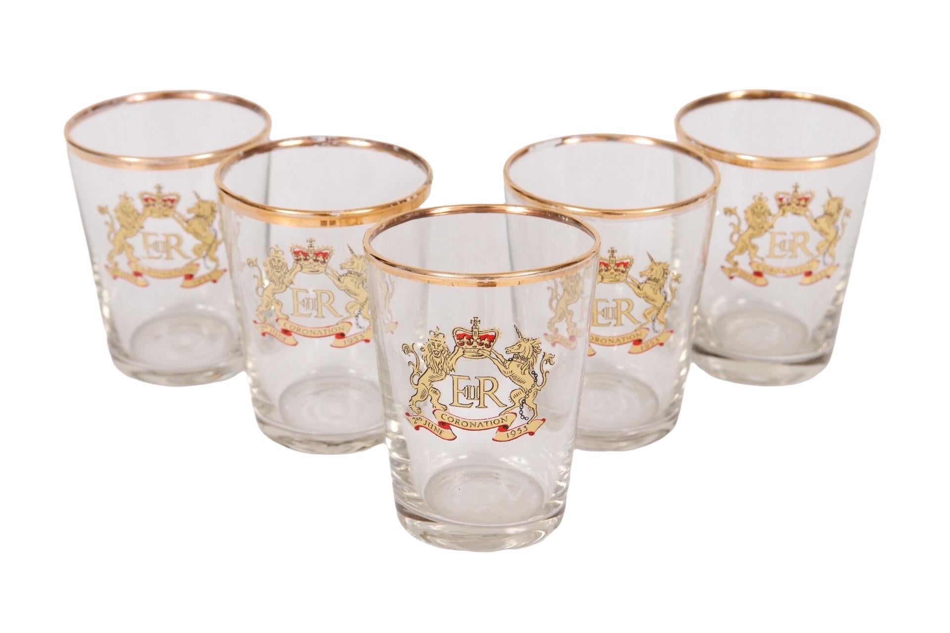 A set of five shot glasses commemorating the coronation of Queen Elizabeth II on June 2nd 1953. Embellished with the Royal coat of arms and a gold rim. Dimensions per glass.