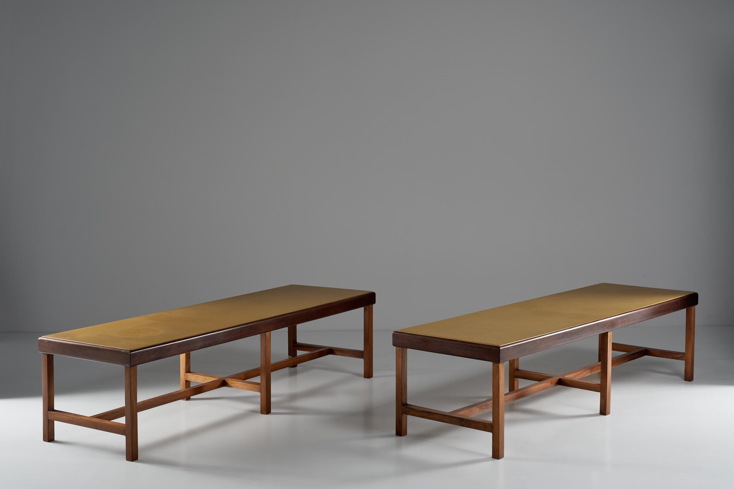 Two wooden benches or low tables and skai coverings. Corrado Corradi Dell'acqua thinks of a shape that can be traced back to the bench but which can nevertheless have a second utility as a low table. The pieces have been realized for a private