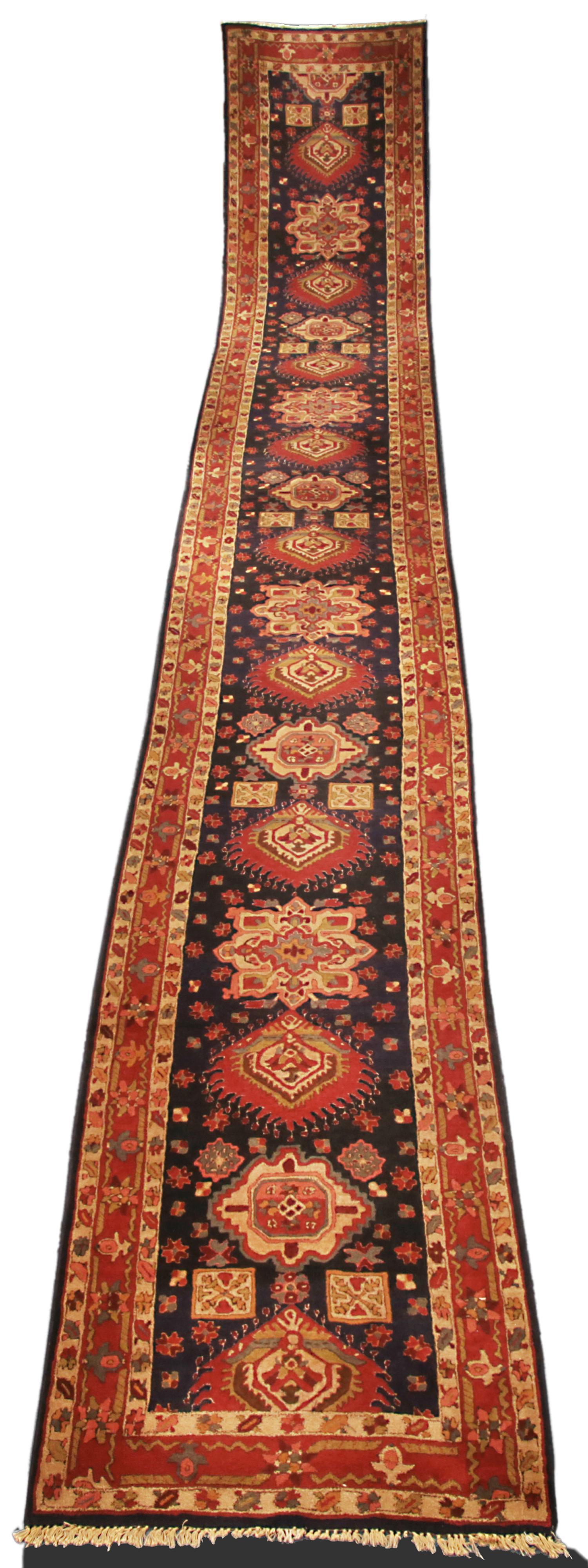 This is an antique German Tetex runner woven circa 1940 and measures 740 x 100CM in size. This rug's design is inspired by the Karajah rug woven in Northwest Persia and its geometric design makes them extremely desirable by designers and collectors
