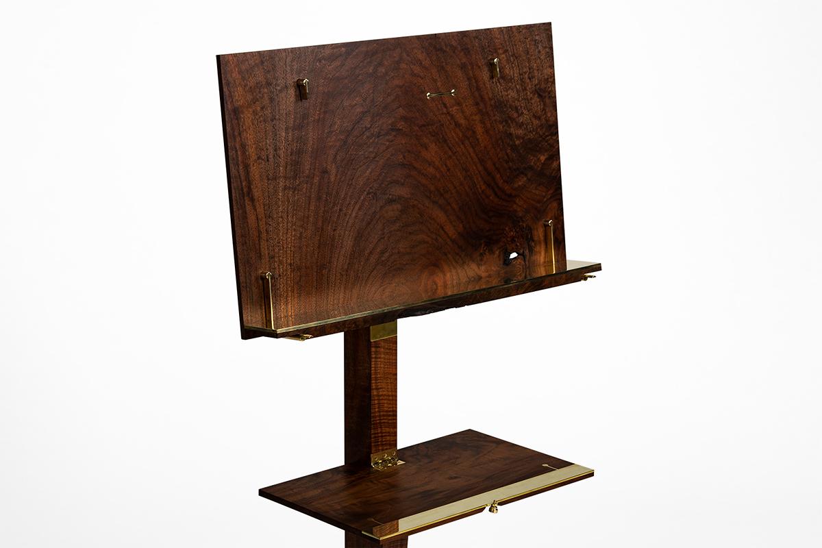 Crafted from the highest musical grade of California Walnut and polished brass, the Corset Music Stand by Taylor Donsker is designed to elevate the experience of the musician and their audience.  Hand selected California Walnut feature natural