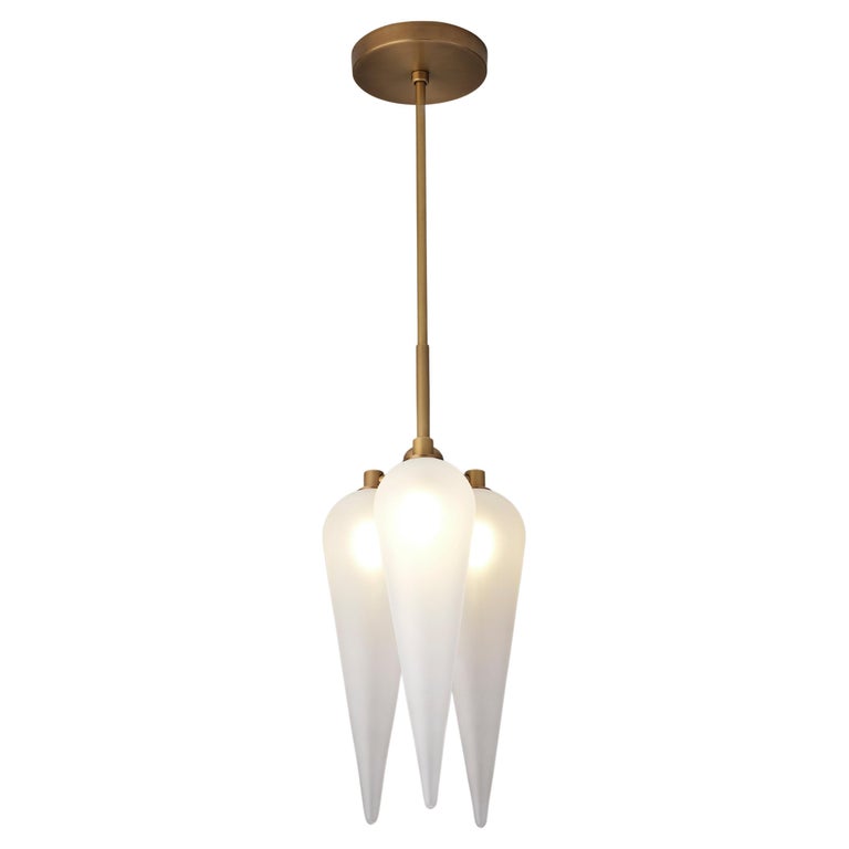Cortello pendant is Blueprint Lighting's modern take on classic Art Deco design. A wickedly dramatic piece of functional sculpture that emits a stunning candlelit glow featuring elongated blown satin glass shades.
Shown in our popular Natural