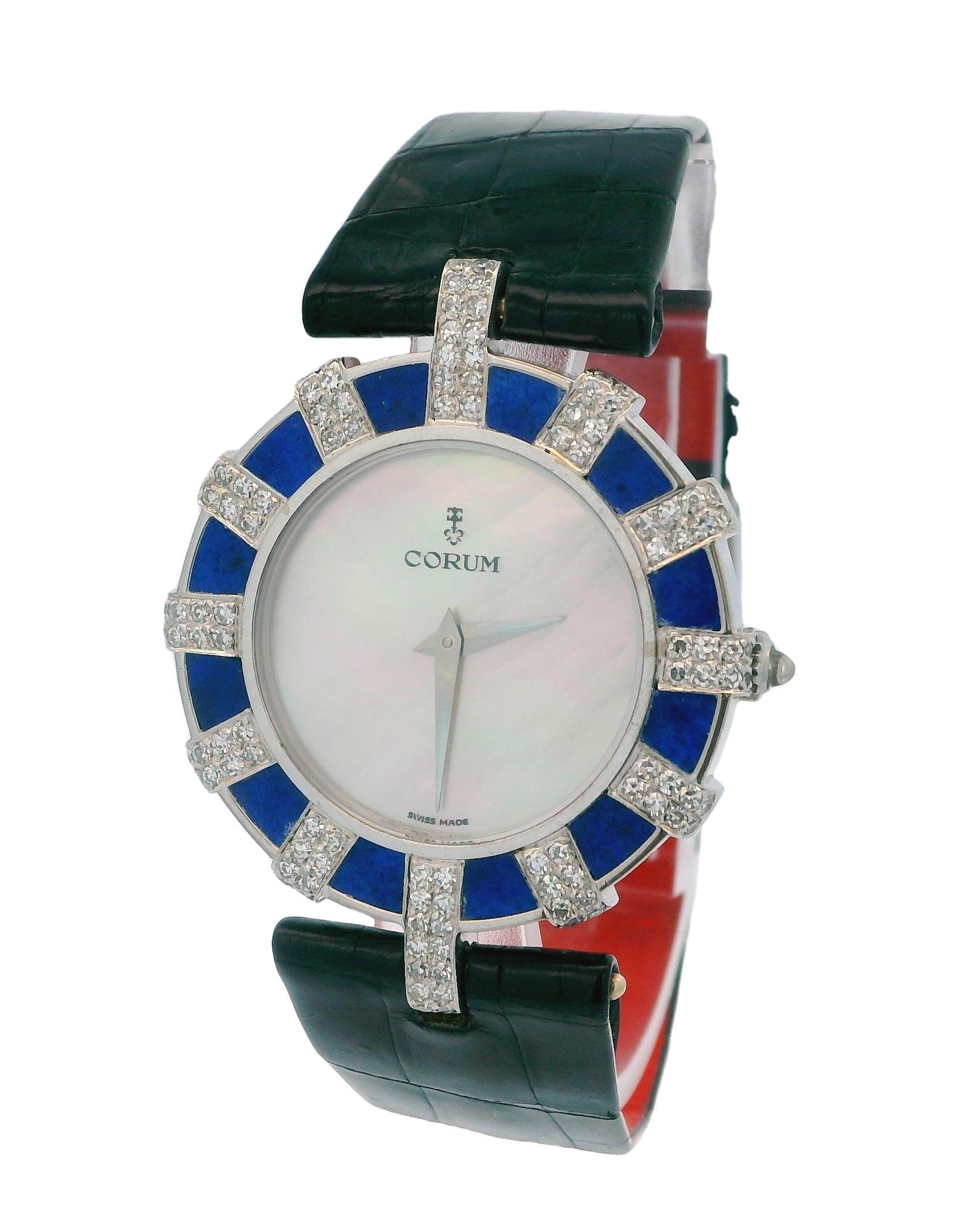 Corum 18K White Gold Lapiz & Diamond Bezel MOP Dial Watch is a luxurious timepiece that embodies elegance and sophistication. The watch features a captivating mother-of-pearl (MOP) dial, which adds a beautiful iridescent quality to its appearance.