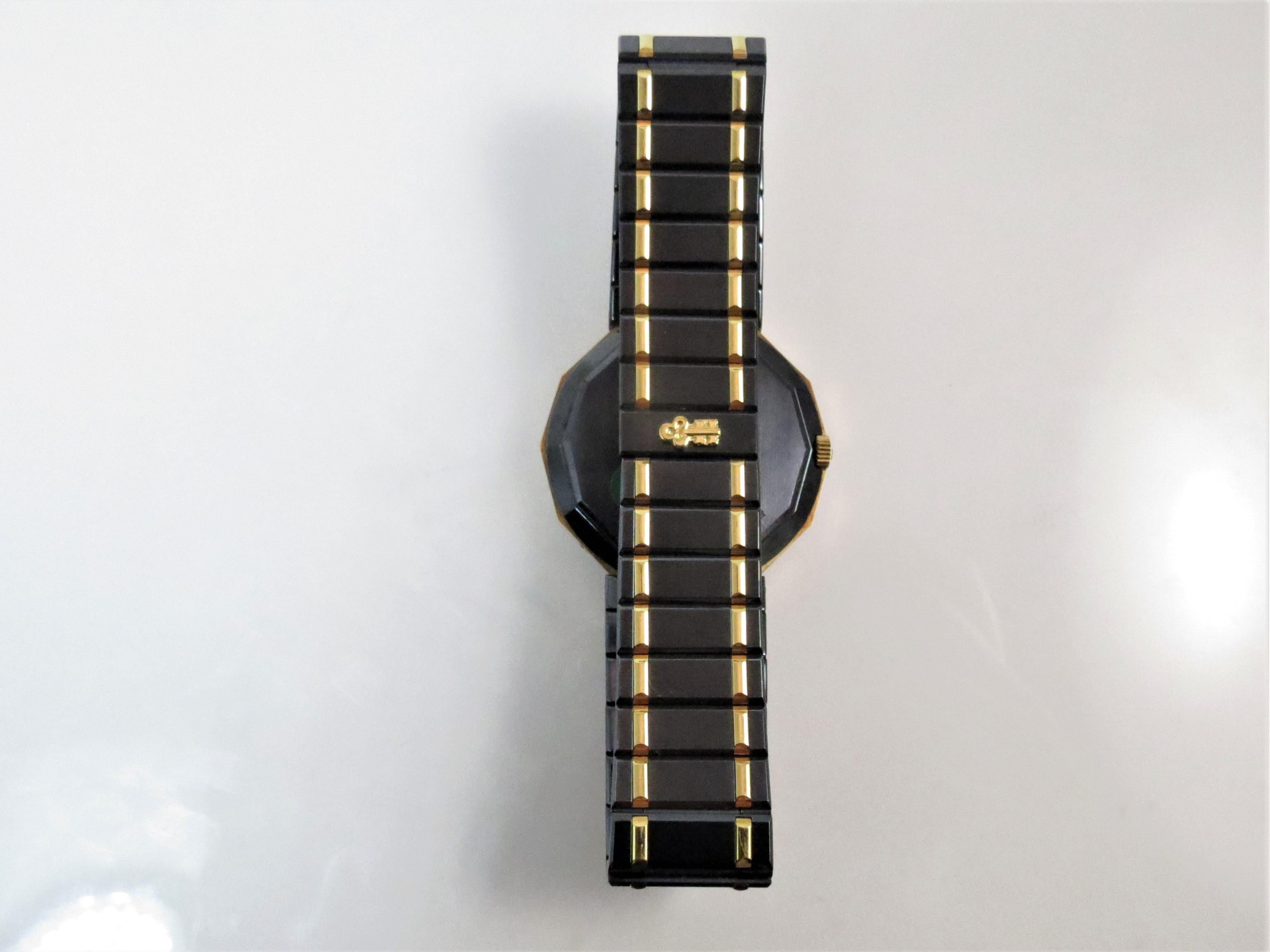 Corum, brand new, never worn, 18K yellow gold and steel 