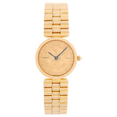 Montre Corum pour femme en or jaune 18 carats avec pièce de monnaie