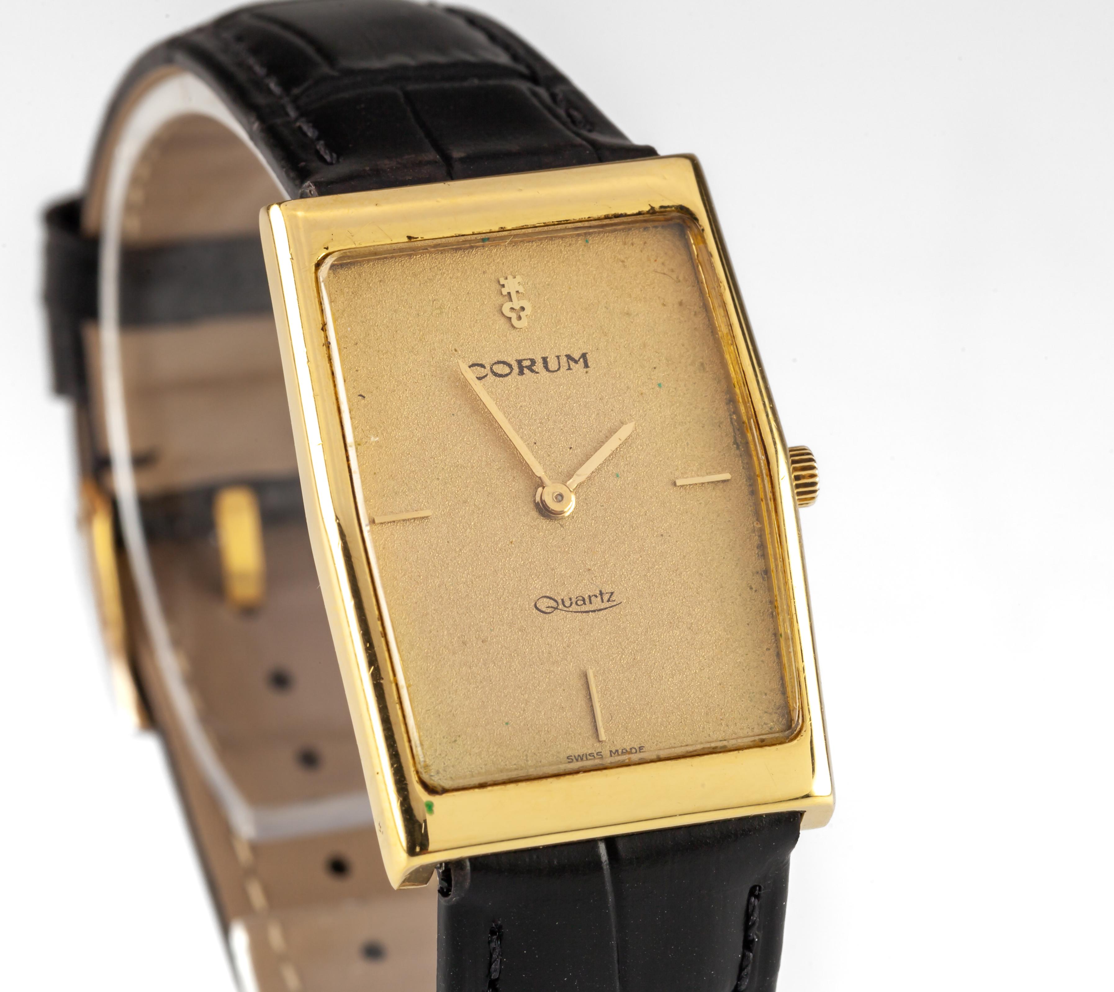 Vintage Corum 18k Gold Watch With Quartz Movement & Black Leather Strap

Serial #: 44107.348851

18K Gold Rectangle Case
23 mm wide (25 mm w/Crown)
32 mm long
Lug-to-Lug Distance: 28 mm
Lug-to-Lug Width: 16 mm
Thickness: 5 mm

Champagne Dial w/Gold