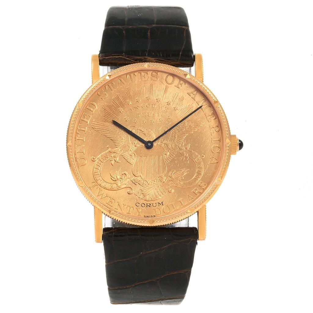 Corum 20 Dollars Double Eagle Yellow Gold Coin Manual Mens Watch. Manual winding movement. 18k yellow gold case with 22k coin 36 mm in diameter. Coin edge. Circular grained crown set with diamond. Mineral glass crystal. 22K coin. Black baton hands.
