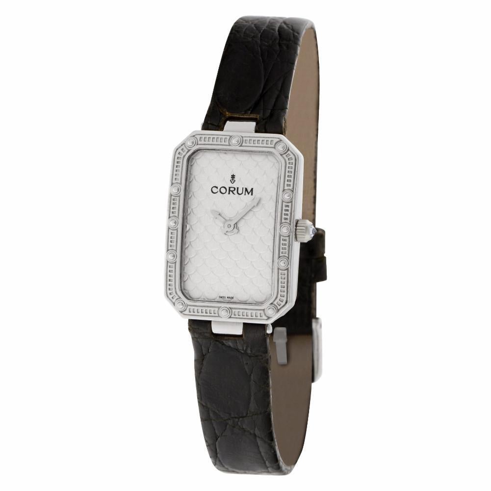 Ladies Corum in 18k white gold on a leather strap. Quartz. Case size 20mm x 28mm. With box and papers. Ref 24 706 59. Fine Pre-owned Corum Watch. Certified preowned Corum 24 706 59 watch is made out of white gold on a Black Leather strap with a 18k