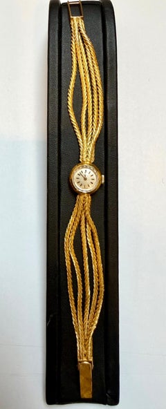 Corum. A lady's 18K gold Multiple Chain bracelet watch 38.5 Gm, 7.25 " Vintage