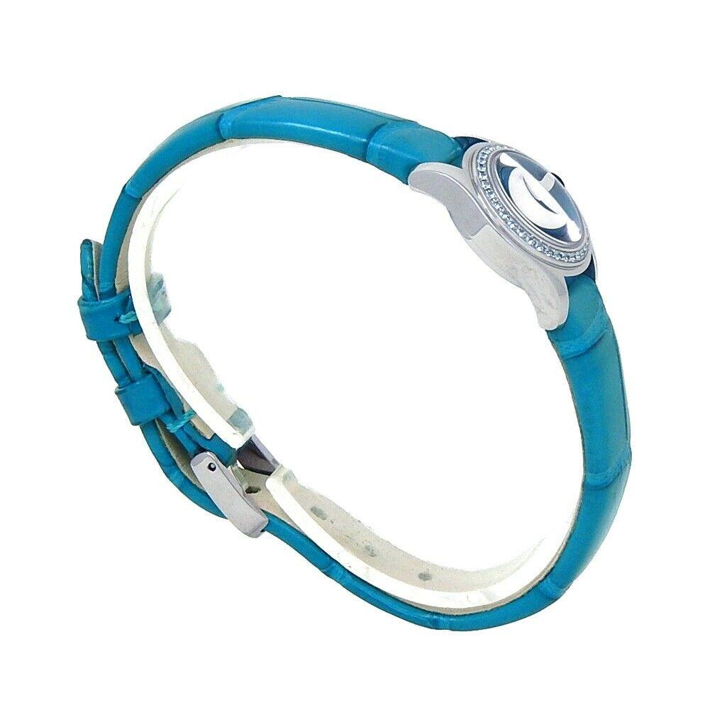 Brand: Corum
Band Color: Blue	
Gender:	Women's
Case Size: 23.5mm & Under	
MPN: Does Not Apply
Lug Width: 9mm	
Features:	Diamond Bezel, Non-Numeric Hour Marks, Sapphire Crystal, Swiss Made, Swiss Movement
Style: Casual	
Movement: Quartz (Battery)
Age