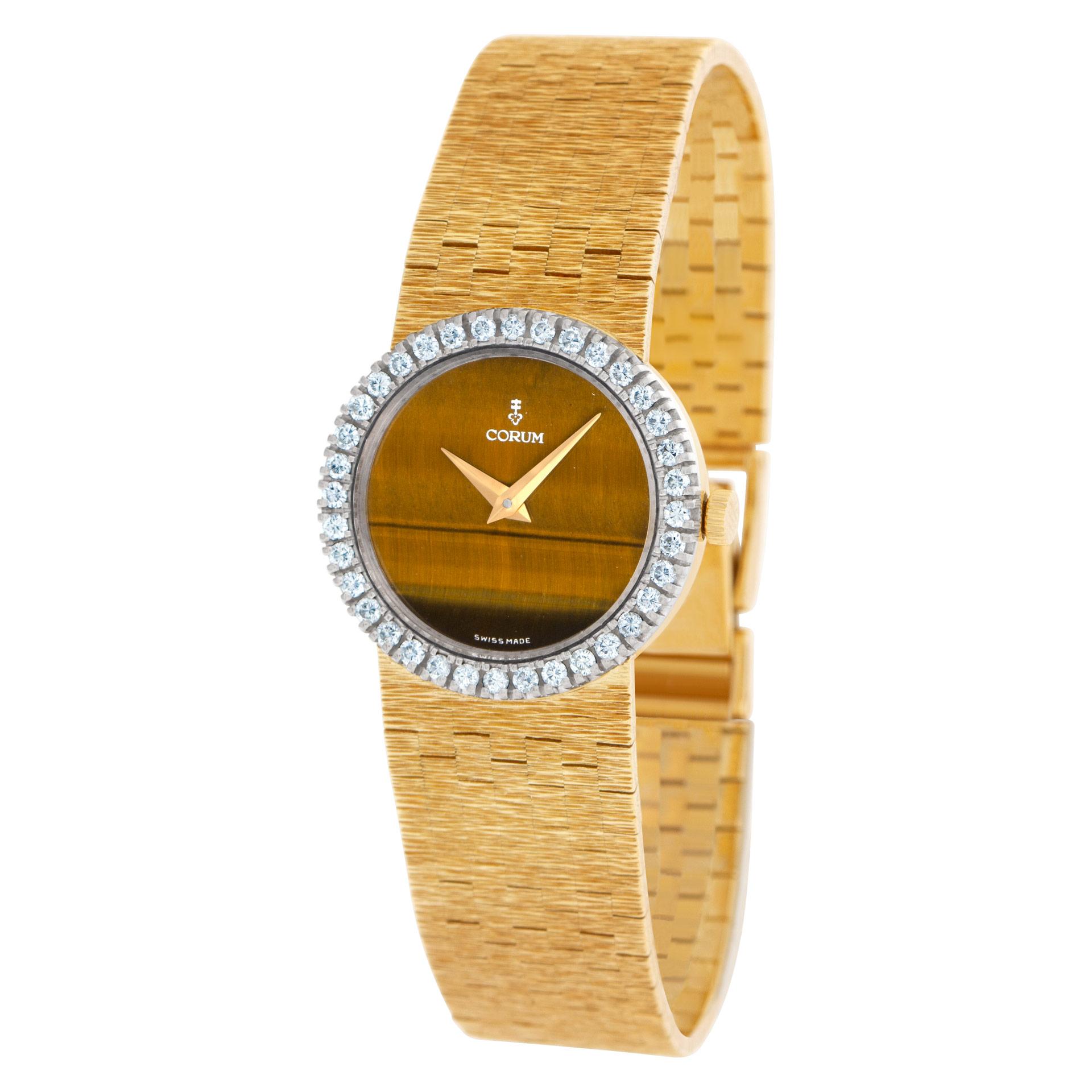 Corum 17J manual wind watch in 18k yellow gold with original factory diamond bezel and tiger-eye dial. Ref 27382A60. 24mm case size. Fits 6.5 inches wrist. Circa 1980s. Fine Pre-owned Corum Watch. Certified preowned Classic Corum Classic 27382A60